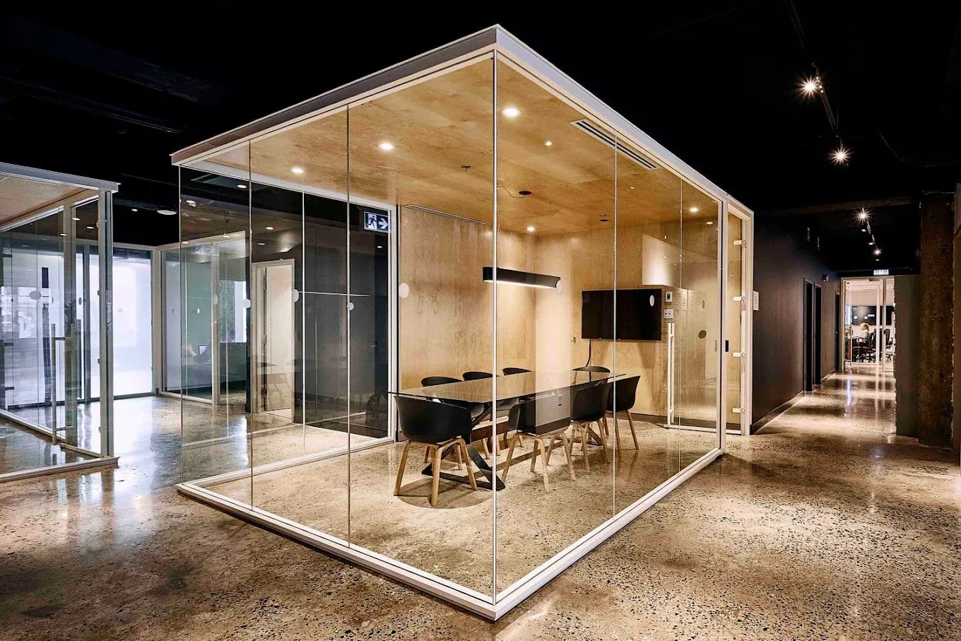Glass-walled boardroom in the Webtec workspace